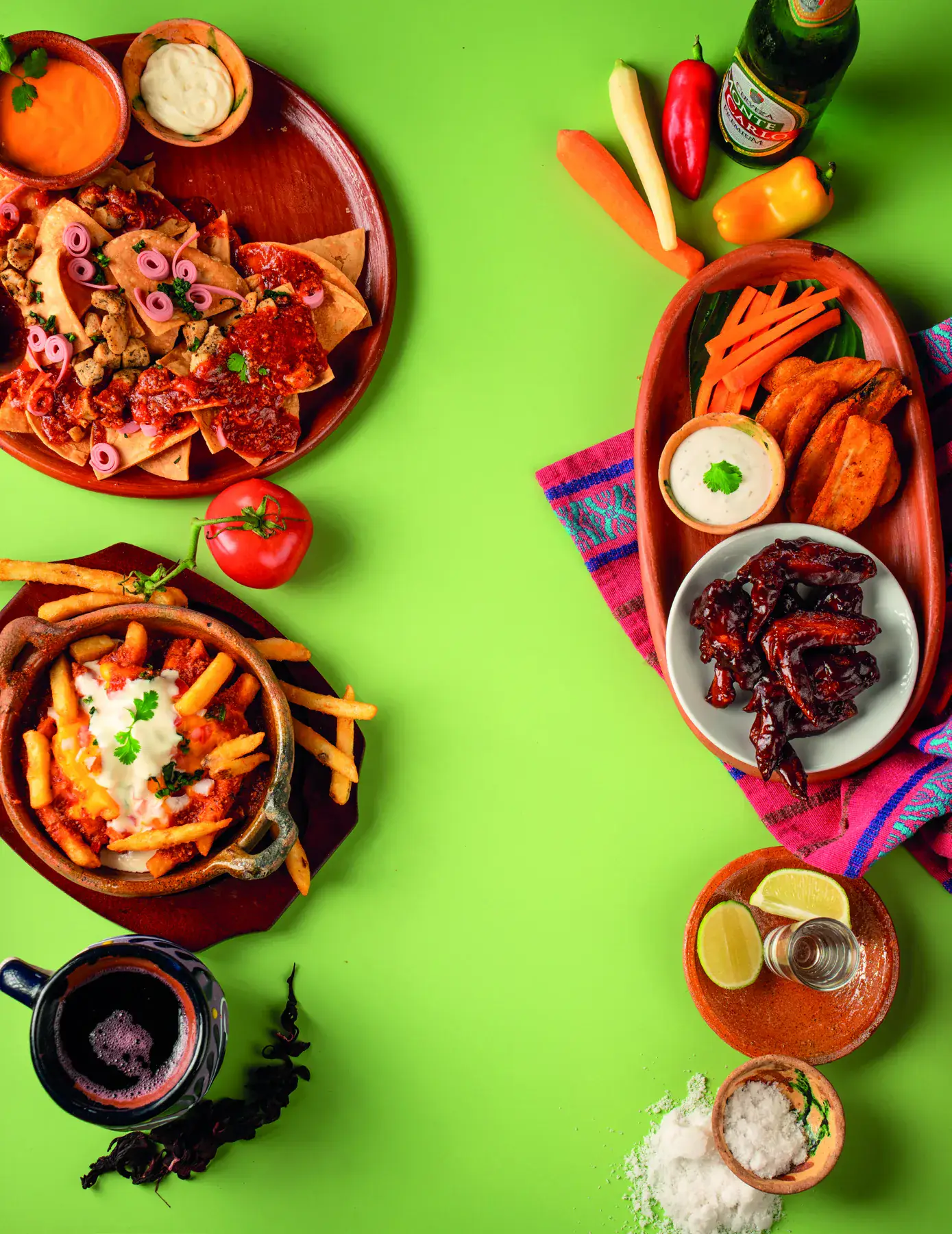 Nachos, papas y alitas de Xwan